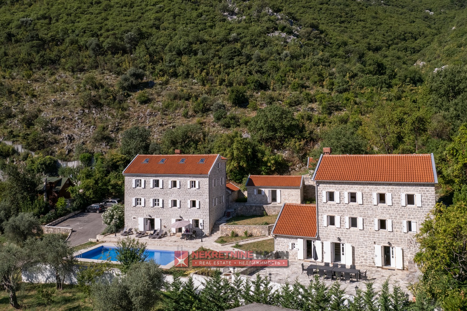 Stone house complex with a large plot of land